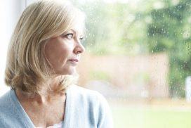 mature lady looking out of window