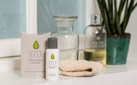 Sylk boxes on bathroom shelf with plant